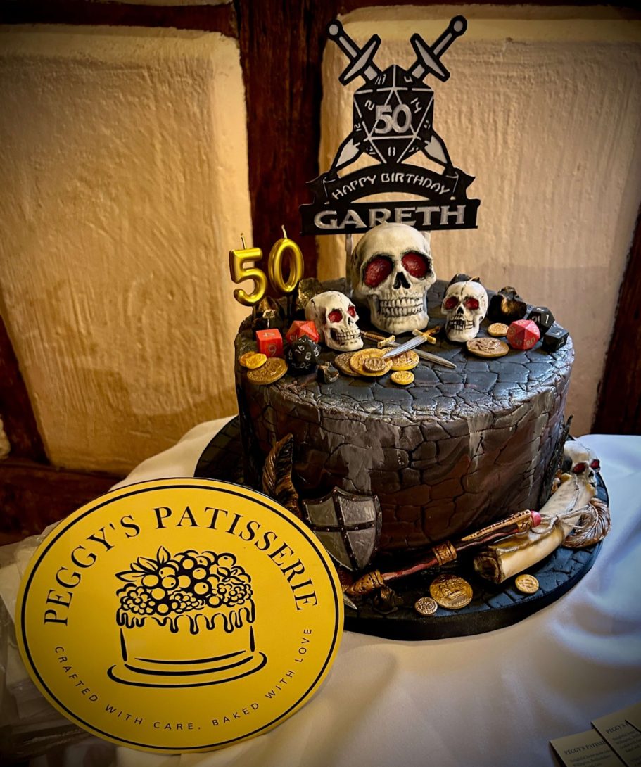 Dungeons n Dragons Dungeons n dragons cake topped with fondant skulls and dice