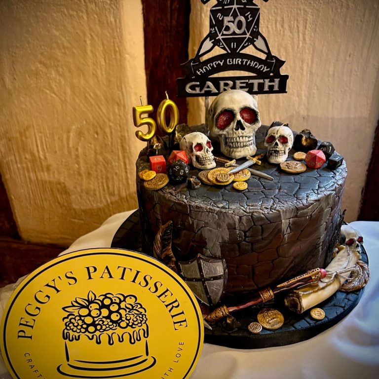 Happy woman with candle-lit birthday cake