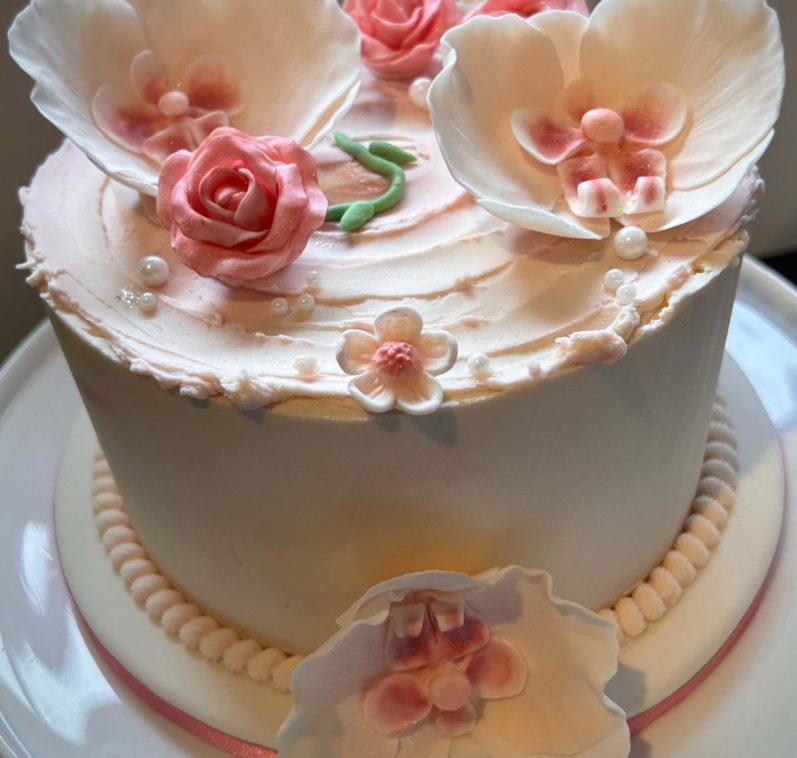 Edible elegance sugar flower and pearl topped pink cake